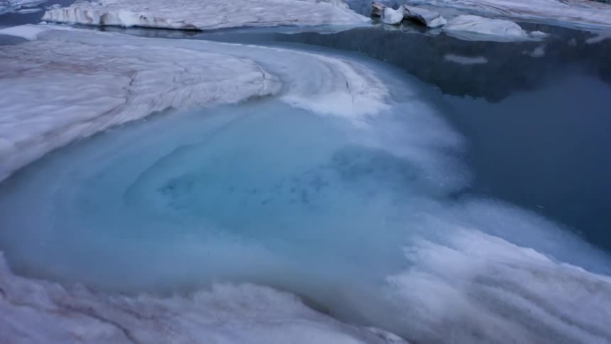The water is covered with icebergs