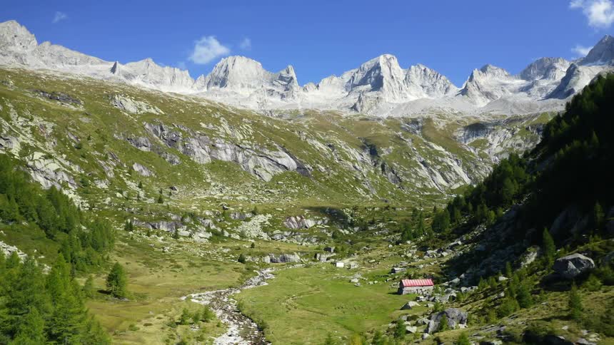 The valley has a small shelter by the mountain edge