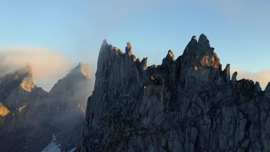 Mountain ridge with peaks high in the clouds