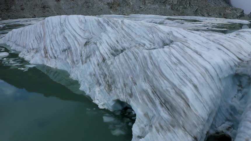 A large iceberg in the water
