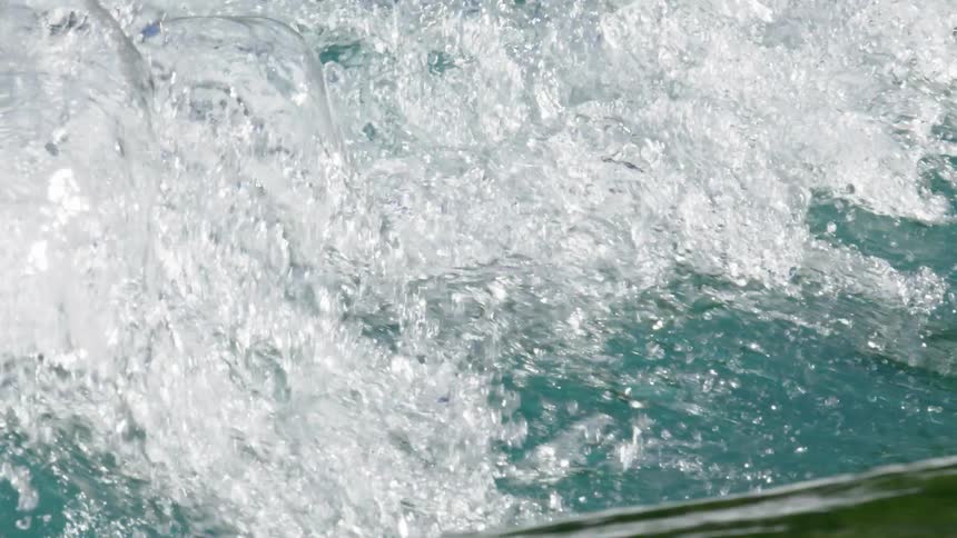 Slow motion shot of pristine cascading water on the emerald Rio Baker in Patagonia