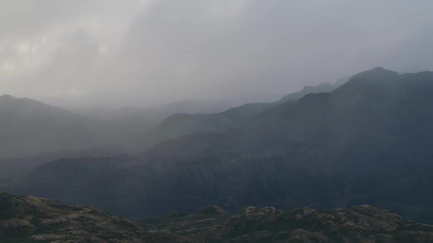 A storm rips across the Andes mountains creating atmospheric perspective in this wide shot