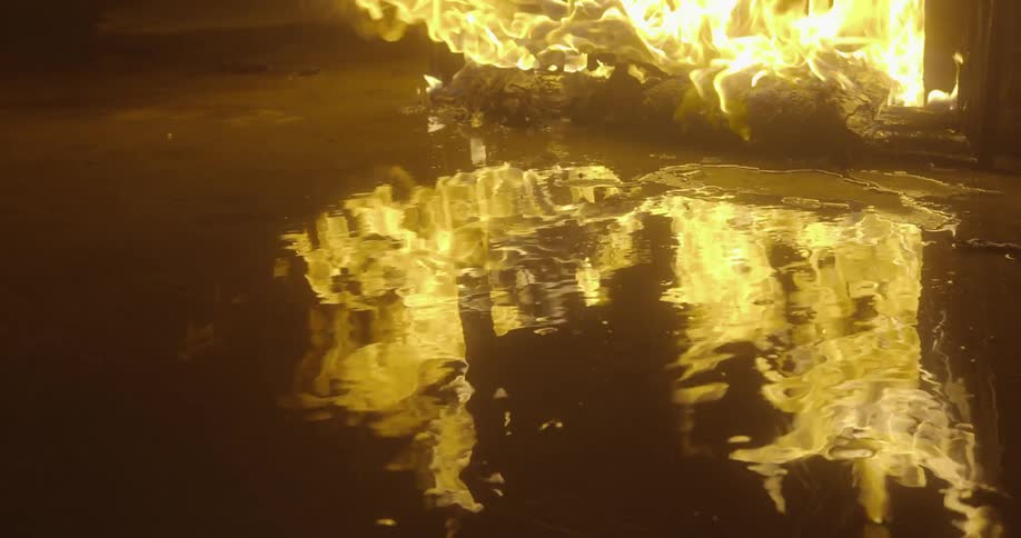 A fire burning on a wet area