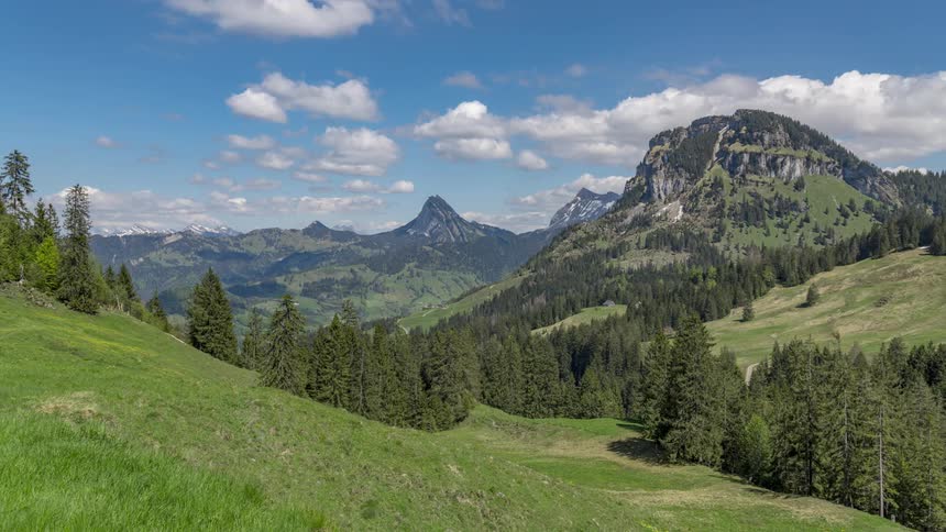 A view of clouds forming over a mountain area