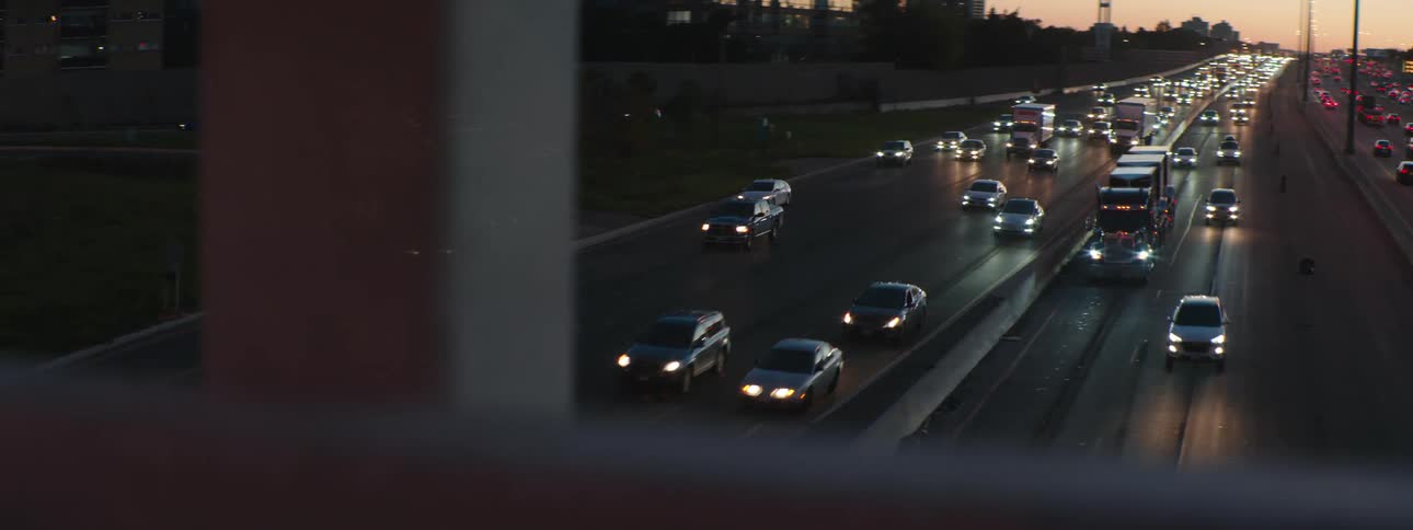 Highway traffic in both directions viewed from an overpass