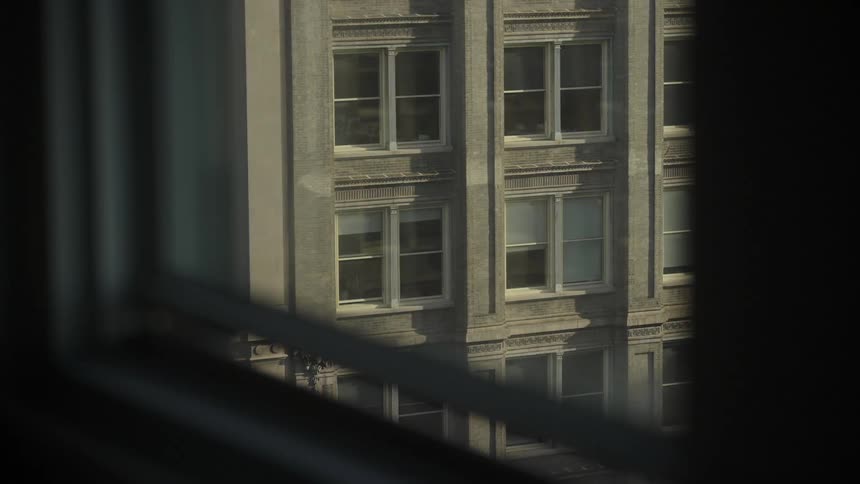 A building can be seen out of a window