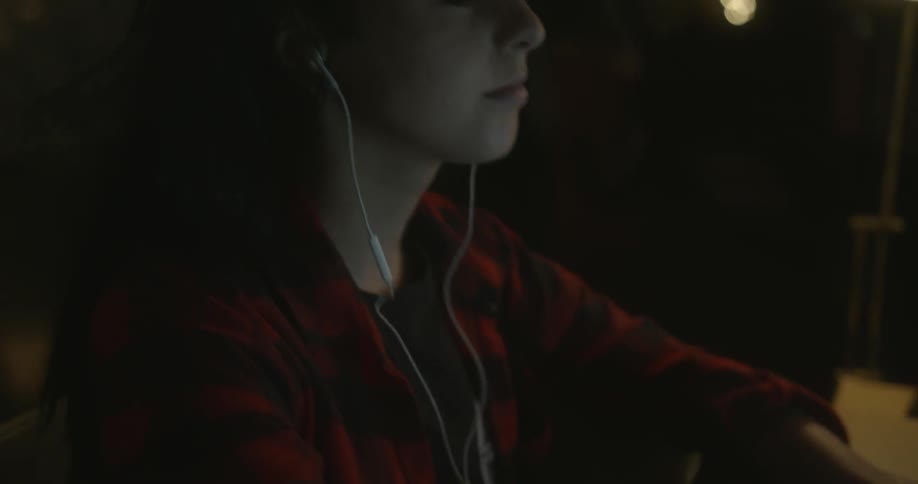A person listens to headphones