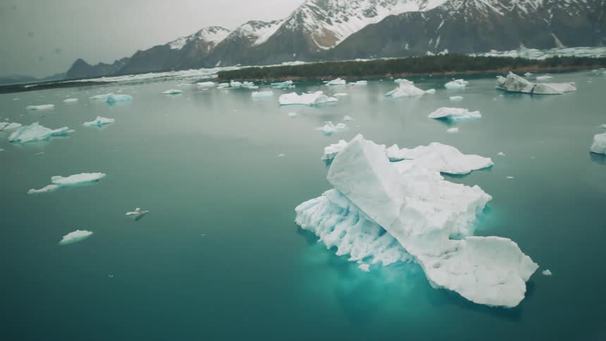 An aerial view of glaciers in a lake