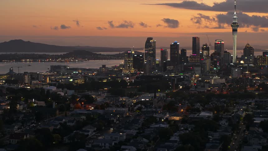 The sun is setting on the coastal city