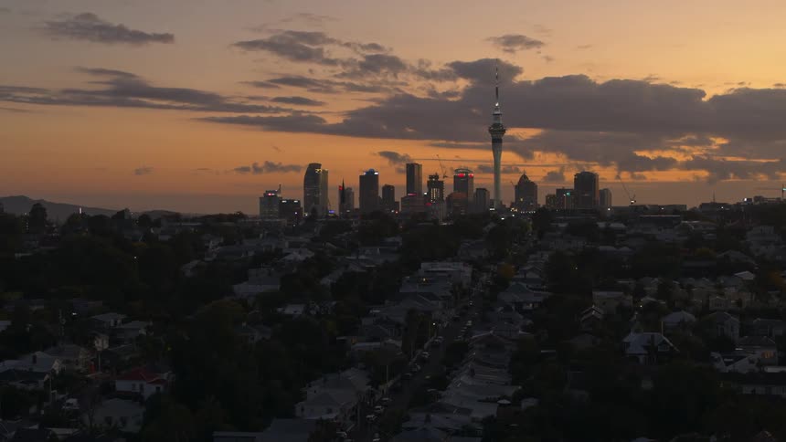 Aerial view of high rise buildings with skyscraper against the red sky at dawn