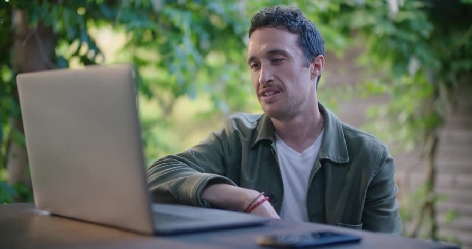 Man on a video call on his laptop