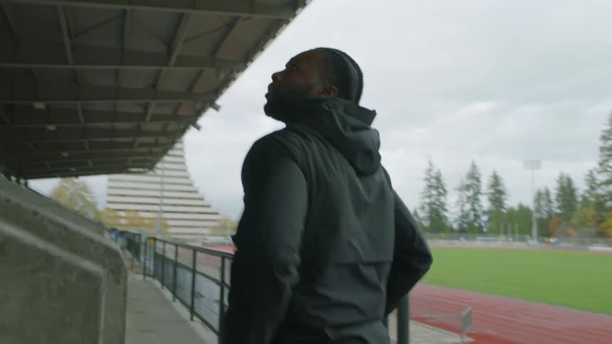 Friends entering a stadium talking to each other in the morning