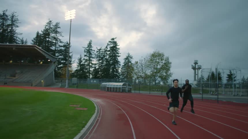 Two men race on the track against each other