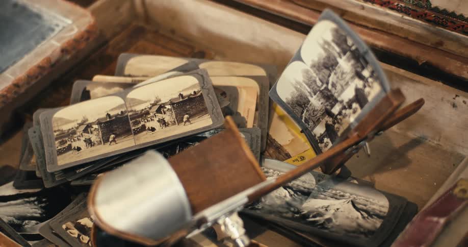 The wooden box is full of old black and white photos