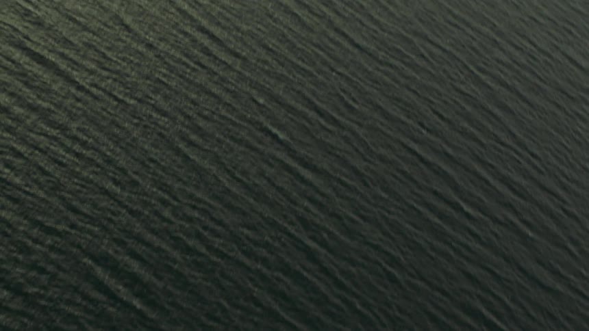 Flying over over a rippled ocean surface
