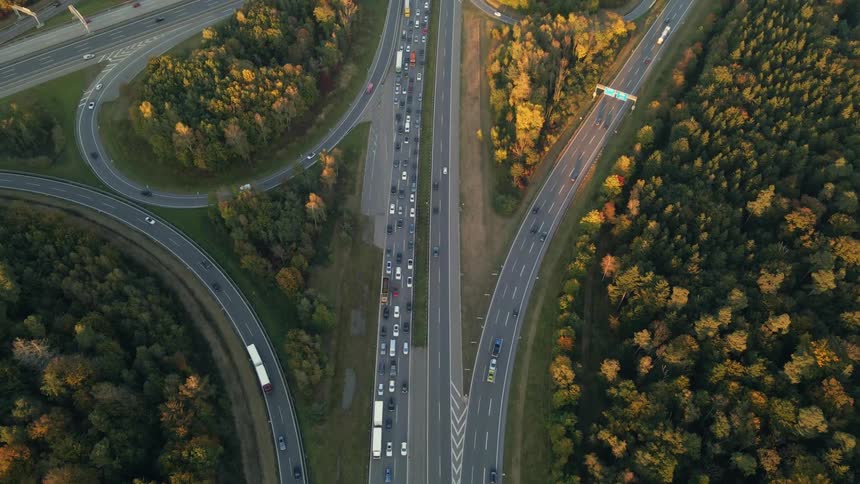 Aerial view of vehicles driving on a highway at morning