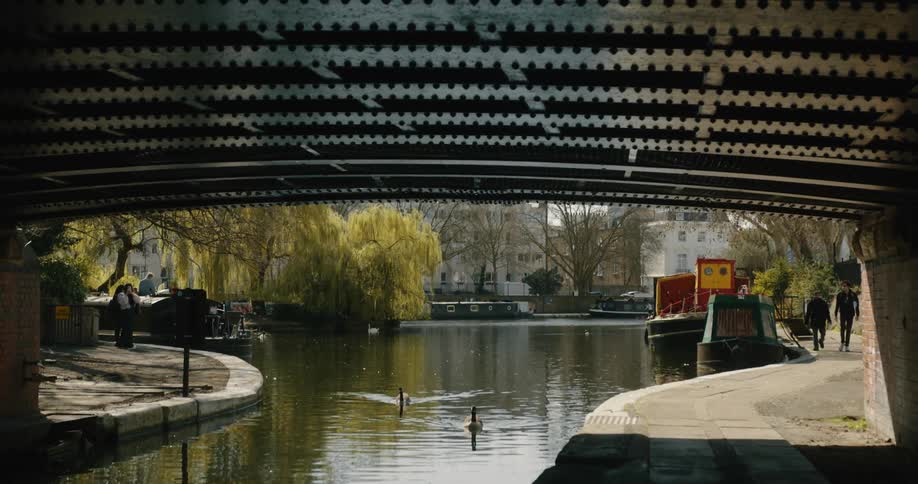 A view of a river running under a bridge in Little Venice
