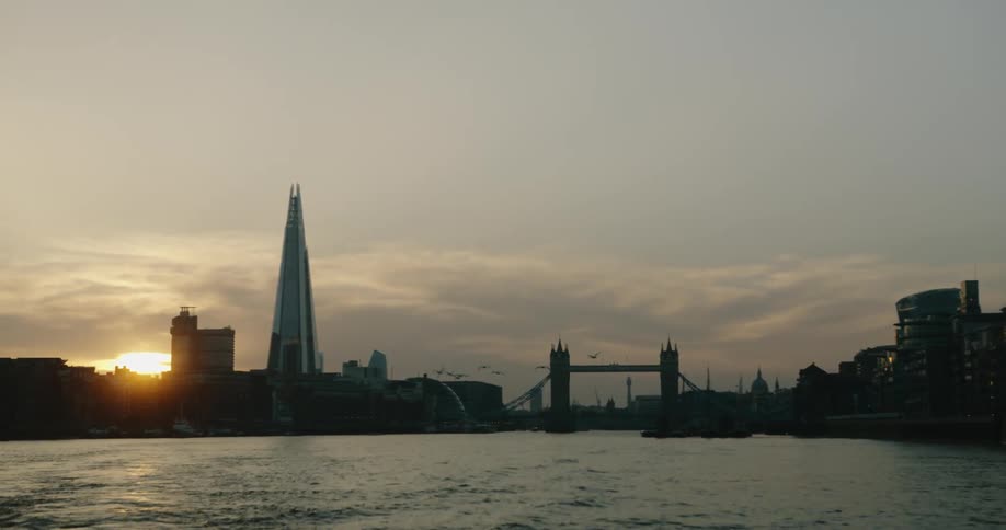 View of London skyline at sunset from River Thames