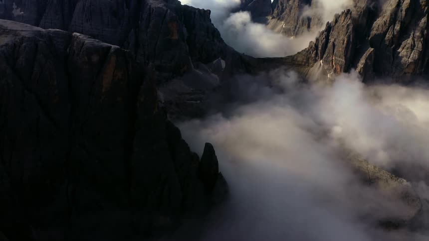 Clouds sit on the surface of the mountains