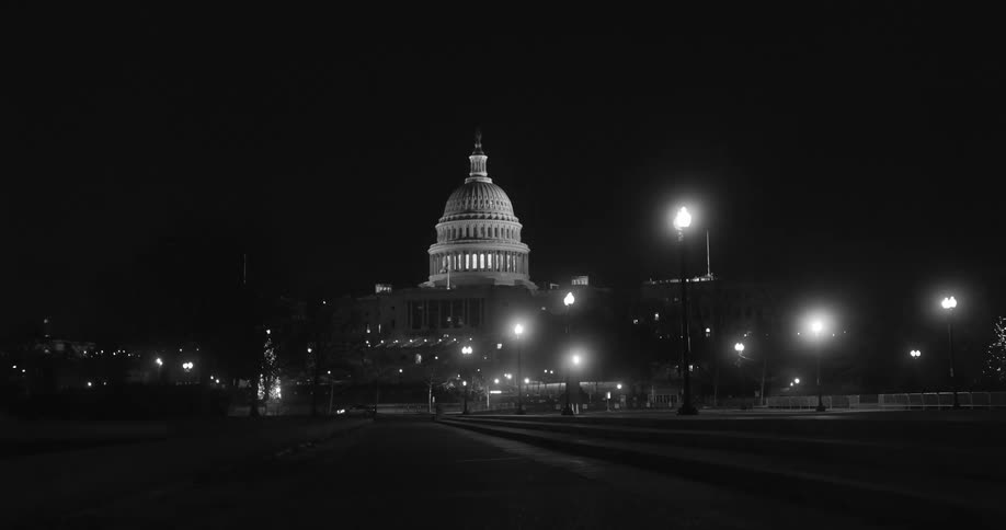 A view of a building outdoors at night