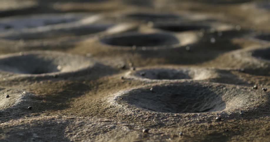 The ground is covered with holes