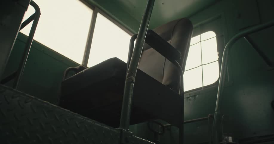 Chair sits on platform near windows on transport