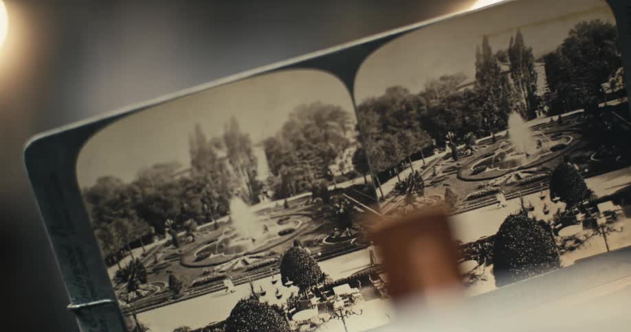 Wood and metal frame holds stereoscope photograph