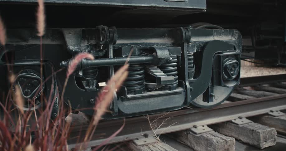 A view of a train wheel sitting on the tracks