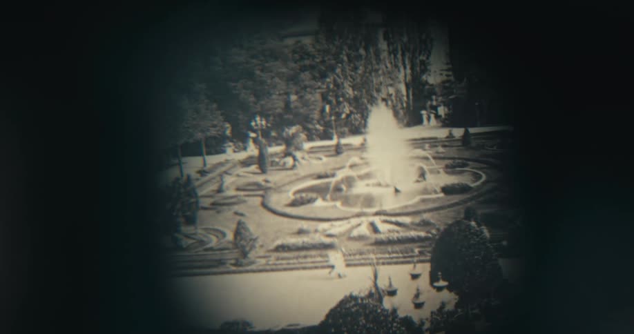 A magnifying glass is put on the black and white photo