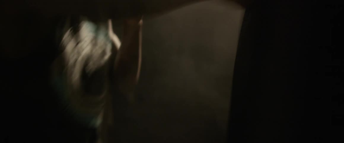 A boxer punches the heavy bag