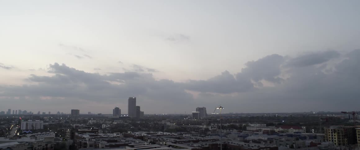 A city at sunrise on a partly cloudy day