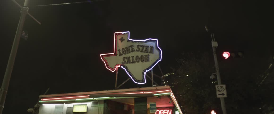 A flickering neon sign at night