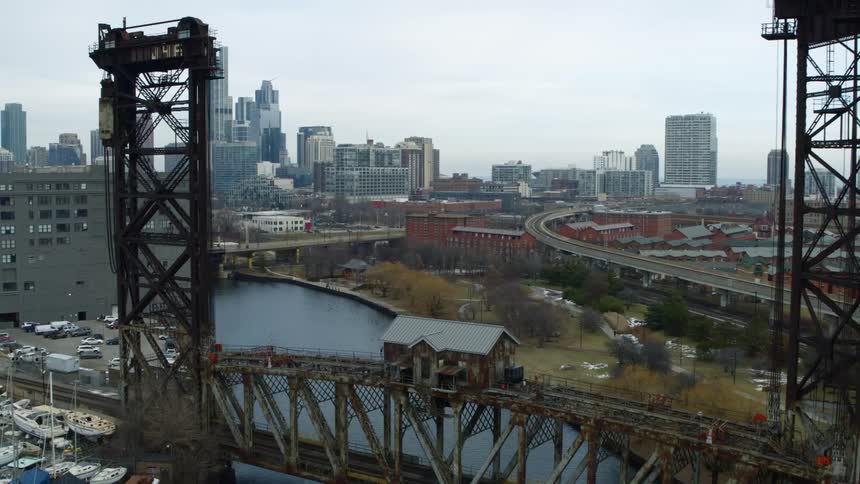 A large bridge is by the dock near the city
