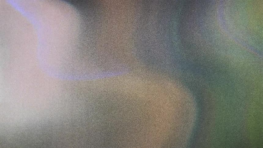 Abstract colorful shapes and flares moving and shimmering caught on vintage film