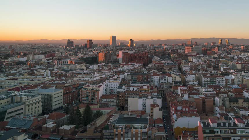 Timelapse of a large city transitioning from nighttime to daytime