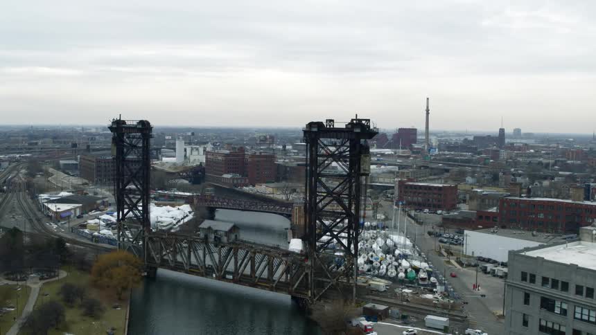 Aerial view of a bridge over a river on the industrial zone of the city