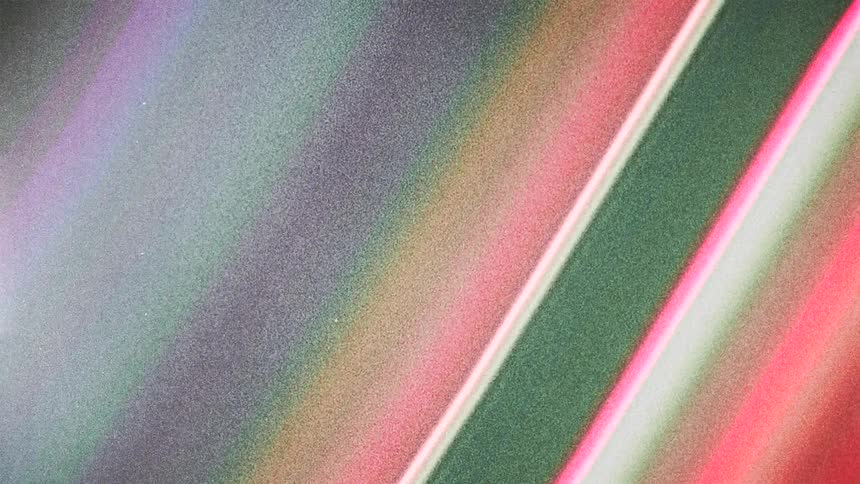 Colorful diagonal slanted pink red shimmering lights caught on vintage film