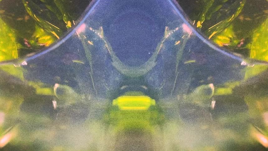 Mirror reflected abstract image of flowing water caught on vintage film
