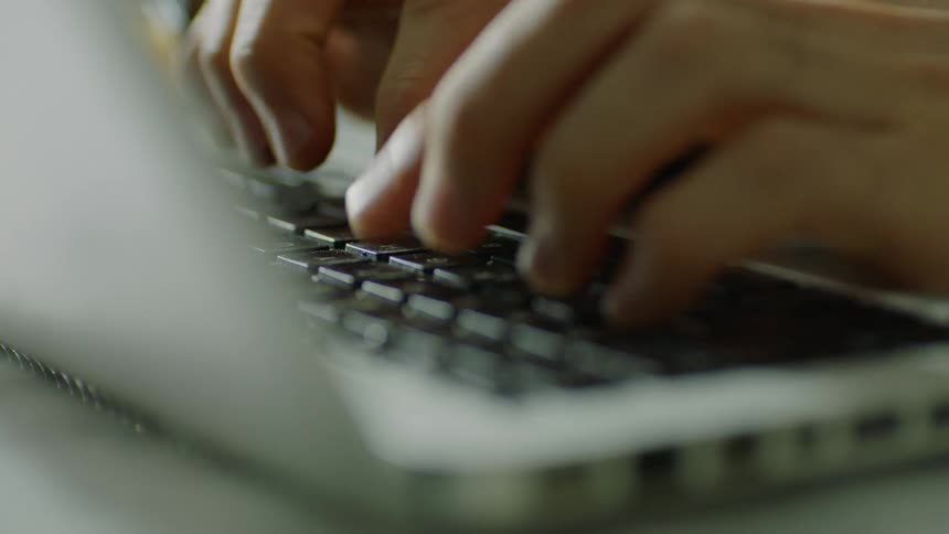Person typing on laptop
