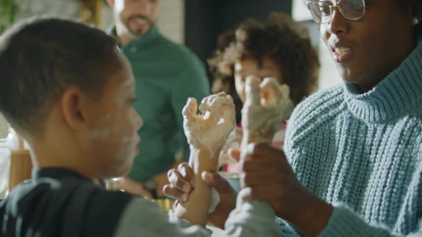 A family cooking food together