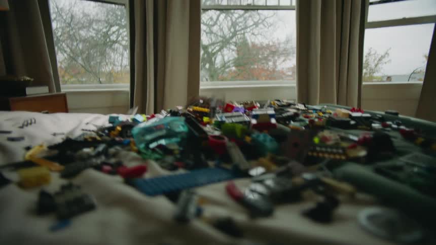 Children throw toys in the bed