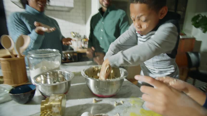 A family working together to bake cookies