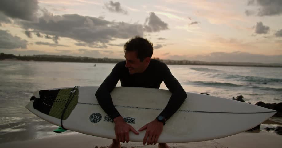 A man holding a surfboard outdoors
