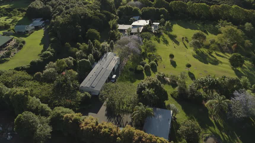 Large buildings and homes sit in landscaped yards