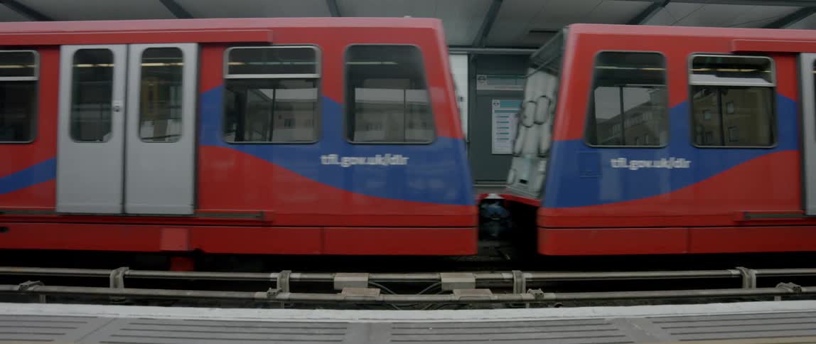 A train slowly takes off from a station
