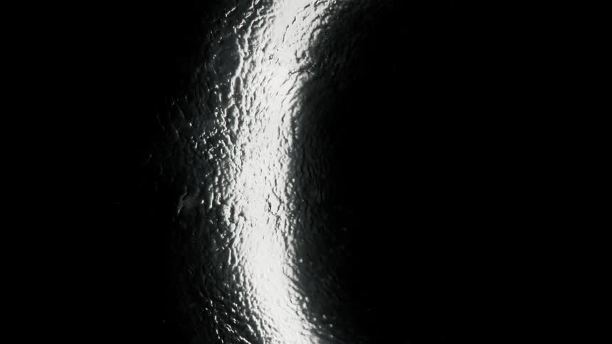 The light is reflecting on the black surface