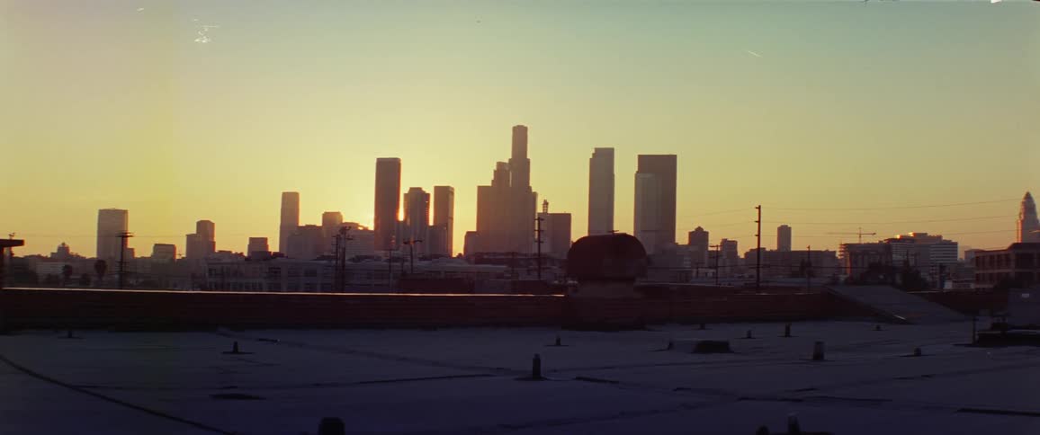A view of a large city area at sunset