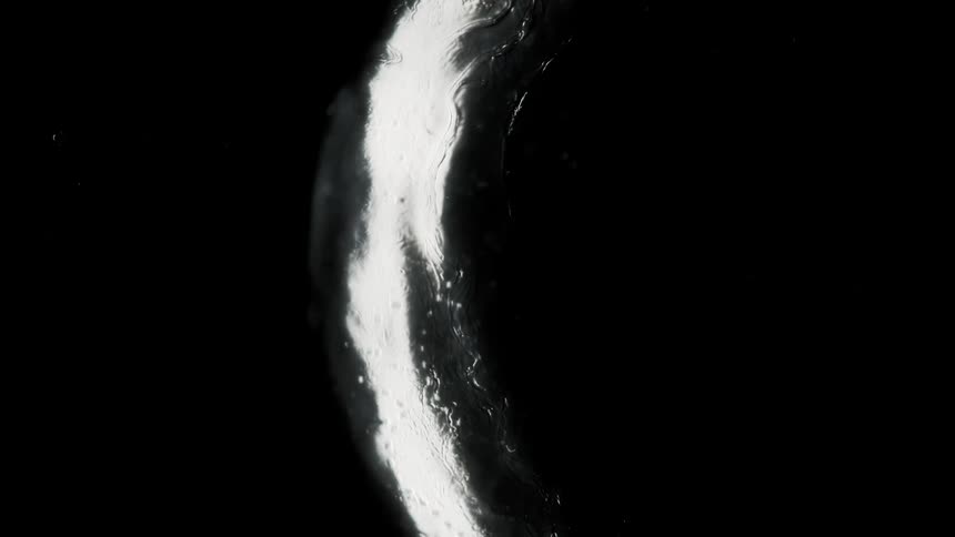 The light is reflecting off the black liquid