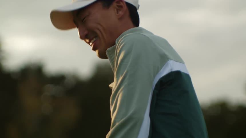 A man looks up and smiles