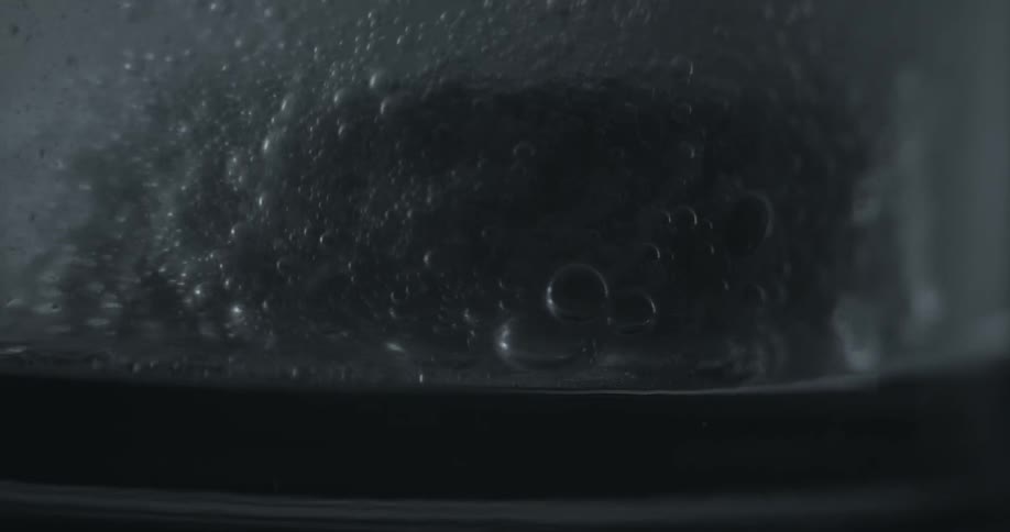 Water is bowling in a container with bubbles rising